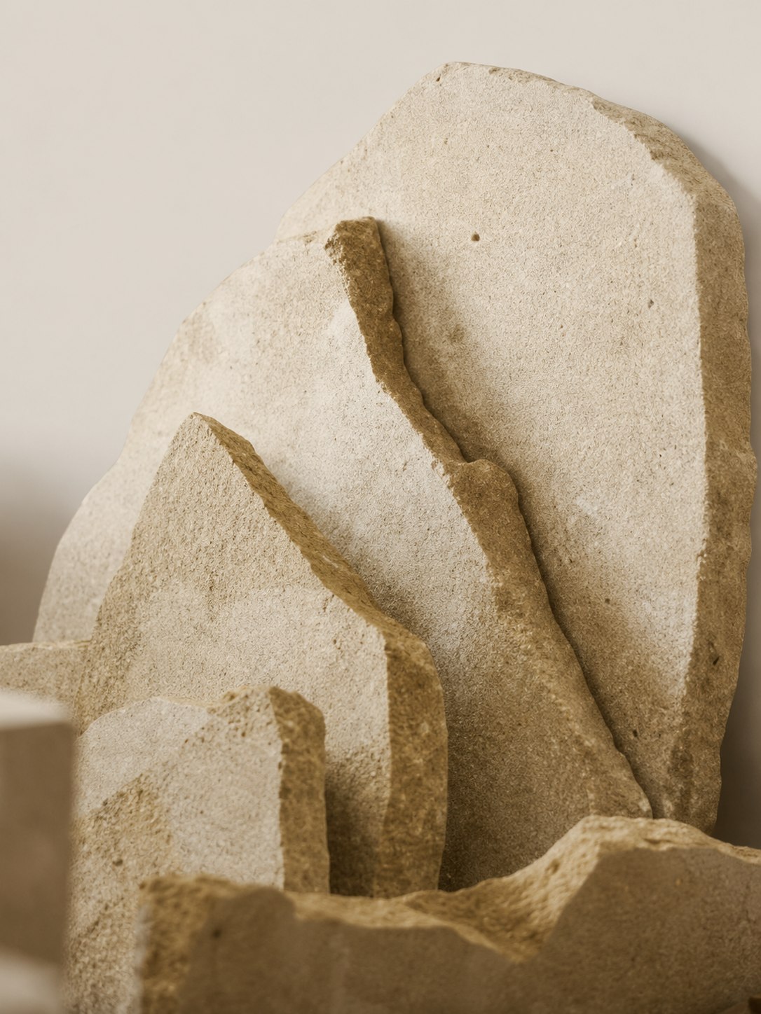 Aurella limestone, warm cream and sand tones with natural surface texture